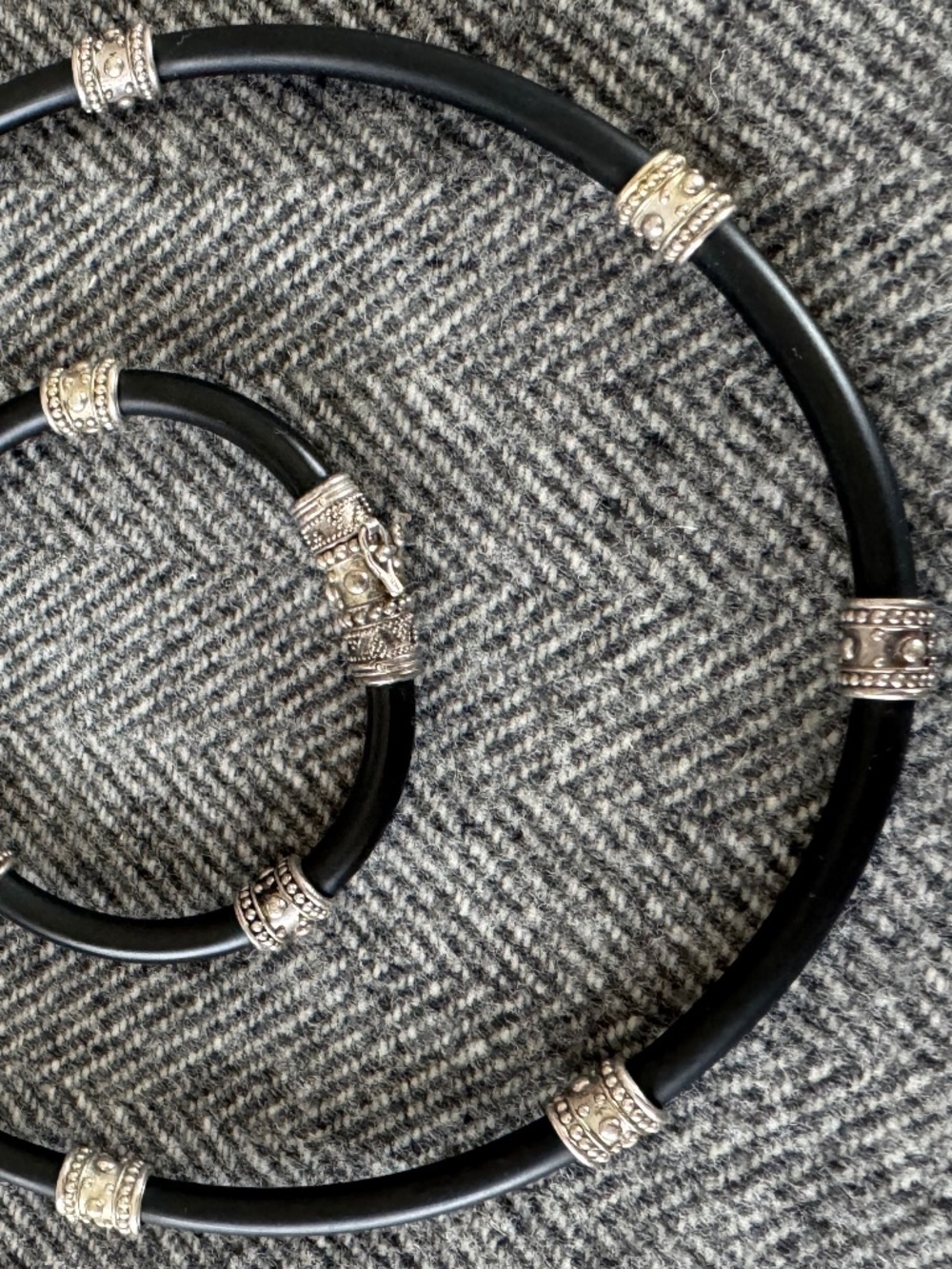 NWOT, HANDMADE IN BALI, INTRICATE SILVER DETAILING ON BLACK RUBBER CORDING